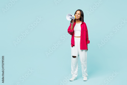 Full body little kid teen girl wear pink shirt white t-shirt hold megaphone scream announces discounts sale Hurry up isolated on plain pastel light blue cyan background. Childhood lifestyle concept.