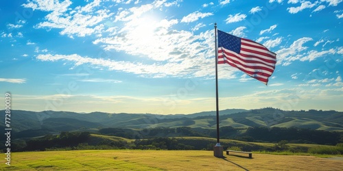 American flag waving in open field under bright sky 🇺🇸☀️ Symbol of freedom and patriotism against clear blue backdrop #ProudlyAmerican
