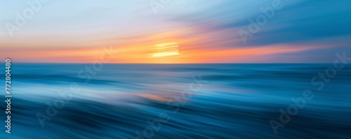 Abstract motion blur of ocean waves at sunset
