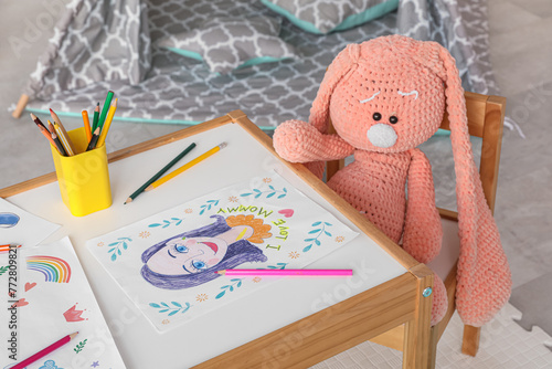 Cute toy rabbit sitting at ...