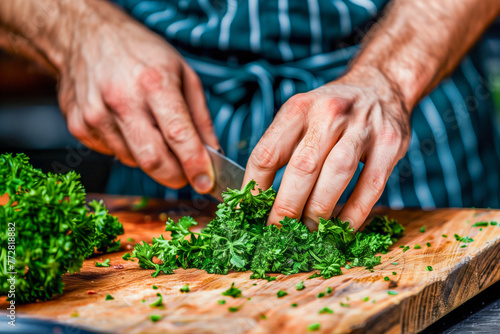 Professional Chef Finely Chopping Fresh Green Parsley on a Wooden Cutting Board. Culinary Arts and Fresh Ingredients Concept