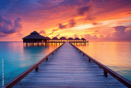 Wooden jetty at sunset in tropical  island with water bungalows An amazing sunset landscape Picturesque summer sunset   Ai generated