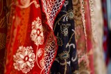 closeup of intricate saree embroidery in a boutique setting