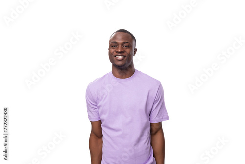 portrait of young smiling american man in lilac t-shirt isolated on white background with copy space