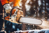 Close up of construction worker cutting trees using portable gasoline chainsaw