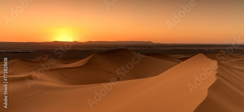 panorama view of the sand dunes at Erg Chebbi in Morocco at sunset