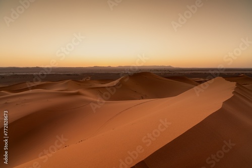 view of the sand dunes at Erg Chebbi in Morocco at sunset