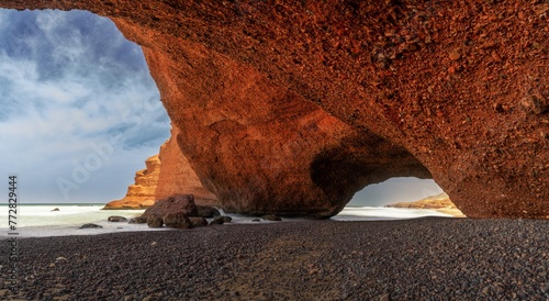 view of the beach and rock arch at Legzira on the Atlantic Coast of Morocco