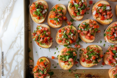 overhead view of tray with prepped bruschetta toasts