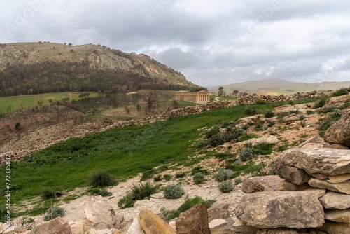 landscape of Segesta with the ancient Greek temple under an overcast sky