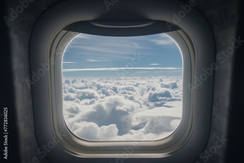 window view from inside the jet showing clouds and sky