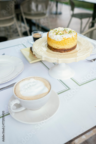Elevate Your Coffee Break: Enjoying a Scrumptious Lemon Tart with a Perfectly Brewed Cup - Stock Photo Ideal for Foodies