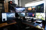 A high-tech gaming setup with multiple monitors, RGB lighting, and gaming peripherals, immersing you in the virtual world during work breaks, Generative AI