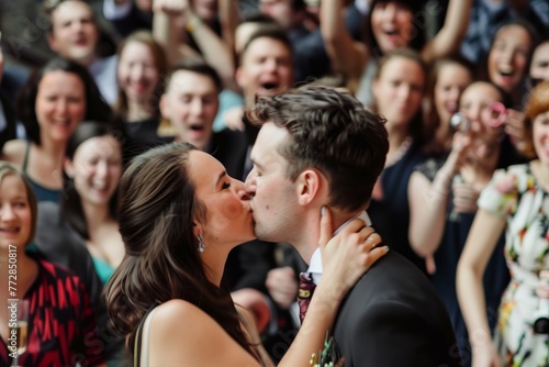 couple kissing, surrounded by cheering crowd