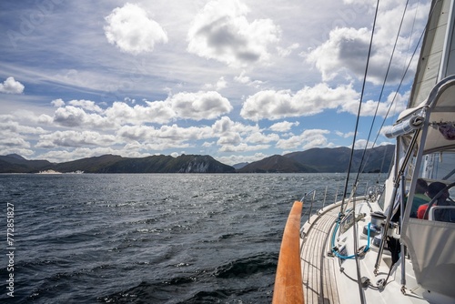 exploring the oceans and world while sailing a yacht with a sail on a beautiful day exploring the australian coastline of tasmania