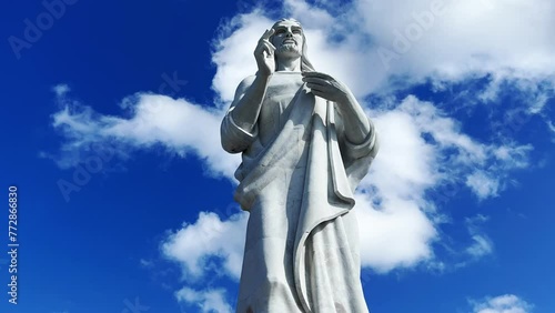 HAVANA, CUBA - DECEMBER 20, 2023: The Havana Christ. A large sculpture of Jesus of Nazareth in white Carrara marble, located on a hilltop in Casablanca, Cuba. photo