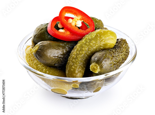 Glass bowl with pickled cucumbers and chili pepper isolated on white background. With clipping path.