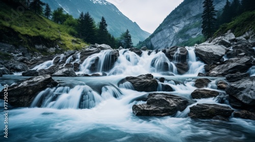 Remote mountain river with cascading waterfalls and trees