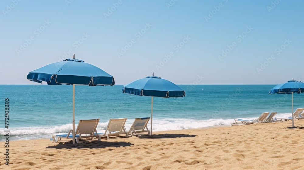 Sandy beach with beach umbrellas and clear blue skies