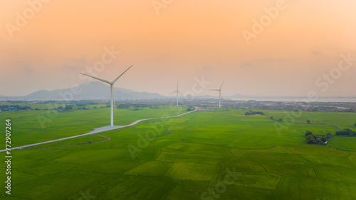 view of turbine green energy electricity, windmill for electric power production, Wind turbines generating electricity on rice field at Phan Rang, Ninh Thuan province, Vietnam