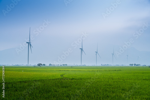 view of turbine green energy electricity, windmill for electric power production, Wind turbines generating electricity on rice field at Phan Rang, Ninh Thuan province, Vietnam © CravenA