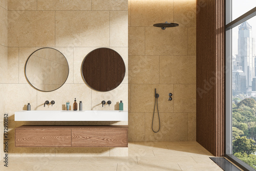 Yellow bathroom interior with double sink and shower © ImageFlow