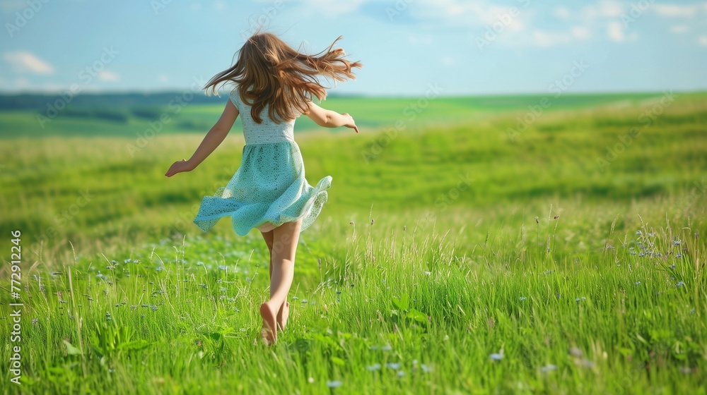 A girl running in the green field. A female in a dress in the summer field. Natural landscape. Bounding with nature. A girl running in the green field. A female in a dress in the summer field. Natural landscape. Bounding with nature.
