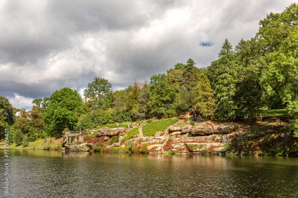 Fototapeta premium Large stones by the lake in the forest in Sofievka park in Uman