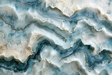 Striking marble tiles in shades of blue and grey reminiscent of ocean waves.