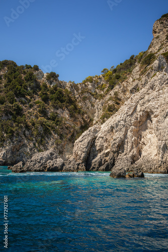 Vertical Scene of Rocky Cliff with Ionian Sea in Greece. Sea Level View of High Stone and Turquoise Water during Zakynthos Travel.