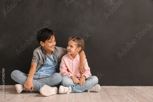 Little children hugging nea...