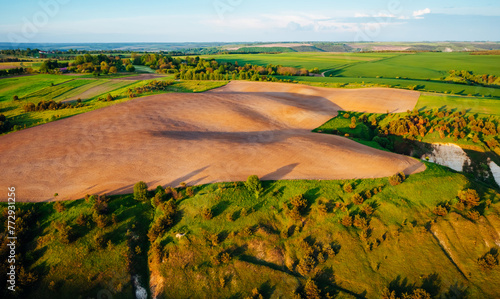Gorgeous summer scene of a rolling hills of agricultural area from a bird's eye view.