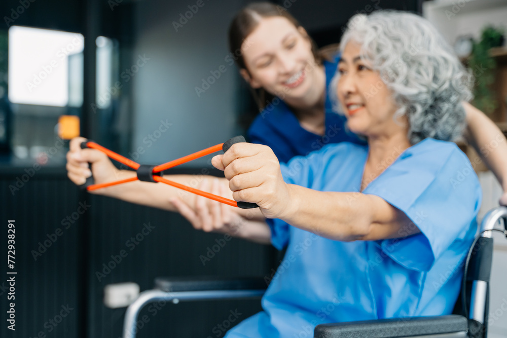 Physiotherapist helping elderly man patient stretching arm during exercise correct with dumbbell in hand during training hand with patient Back problems Physiotherapist helping elderly man patient stretching arm during exercise correct with dumbbell in hand during training hand with patient Back problems