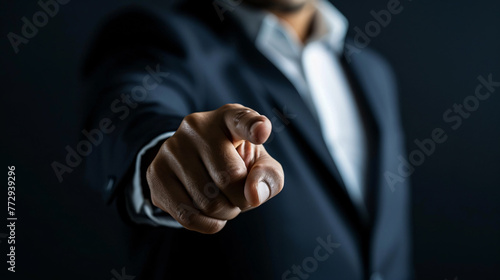 a close up of a hand pointing at the camera