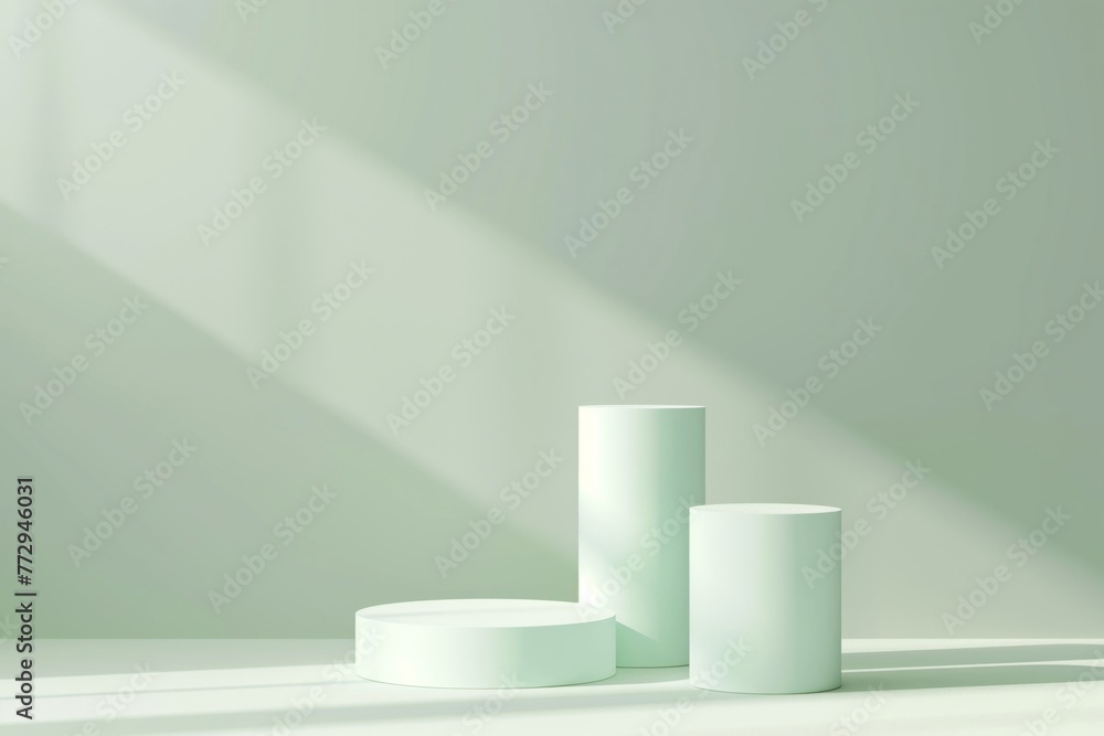 Fototapeta premium Several geometric pastel-green podiums on a monochrome background.
