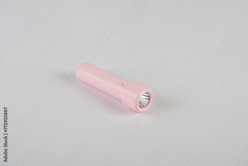 Pink electric LED torch flashlight isolated on a white background Pink electric LED torch flashlight isolated on a white background