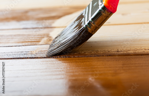 Close up of paint coating and protection of wooden surfaces