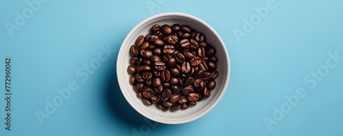 Top view of coffee beans in a white bowl