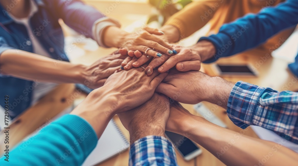 Obraz premium United for Success: Business People's Hands Stacked in a Symbolic Gesture of Teamwork.