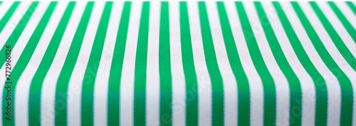 Table top covered with green and white stripped picnic tablecloth, food background, PNG file