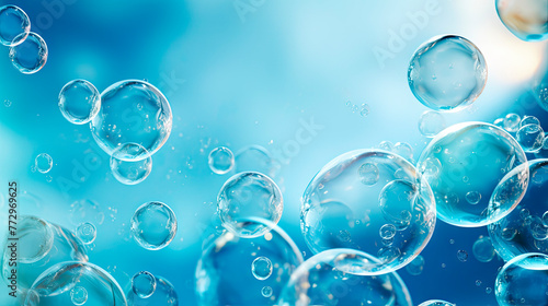 Floating soap bubbles against blue background