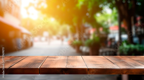 Wooden table closeup with blurred cafe background