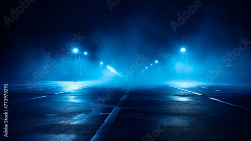 Empty foggy street with street lights