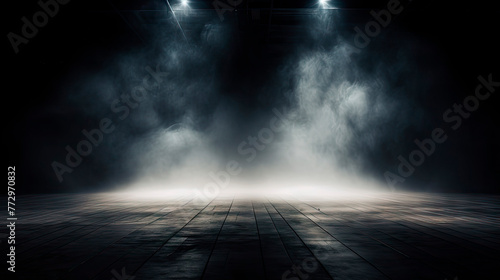 Dark room with ceiling spotlights and smoke