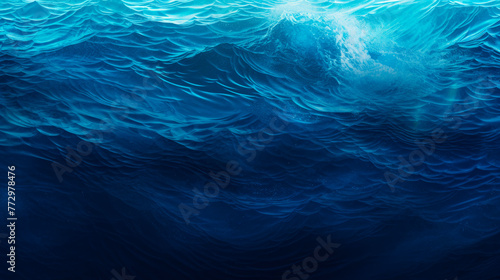 A wave in the ocean under a clear blue sky