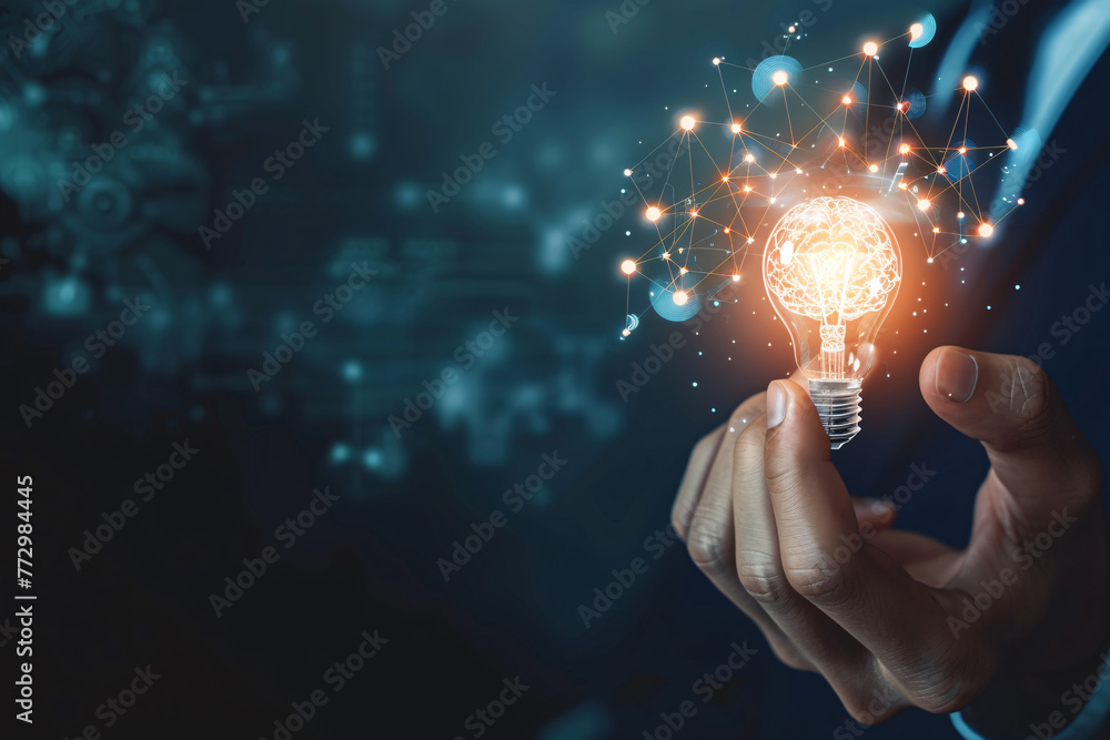 a hand holding a light bulb a hand holding a light bulb