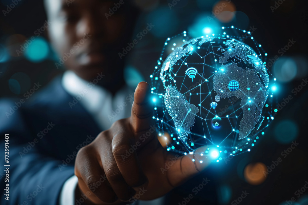 a man pointing at a glowing globe a man pointing at a glowing globe