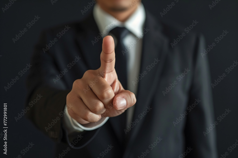 a man in a suit pointing his finger a man in a suit pointing his finger