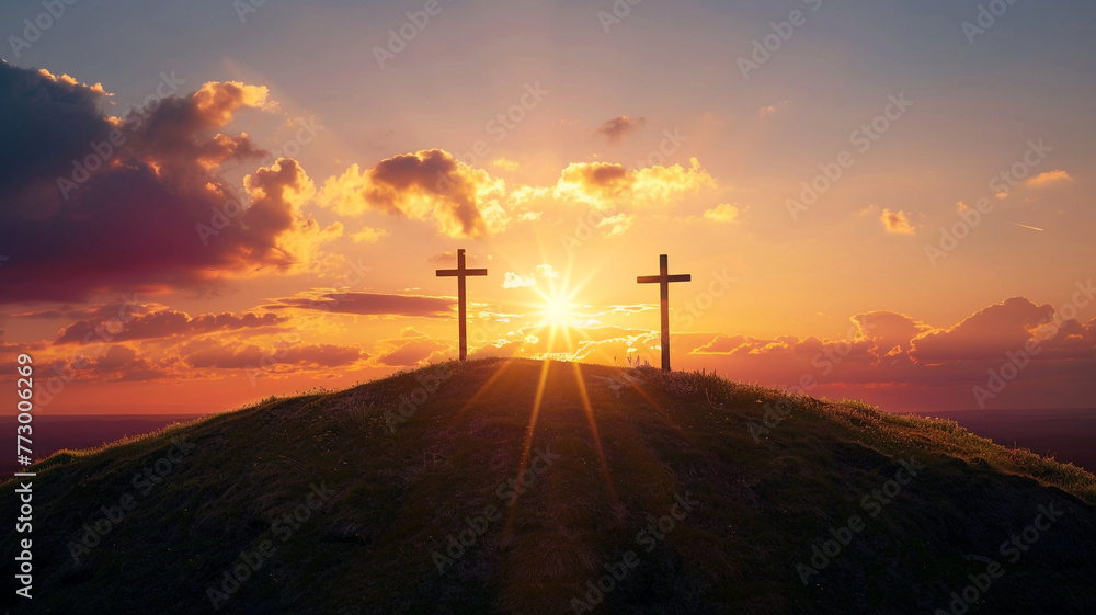 Obraz premium Three crosses stand a hill at sunset