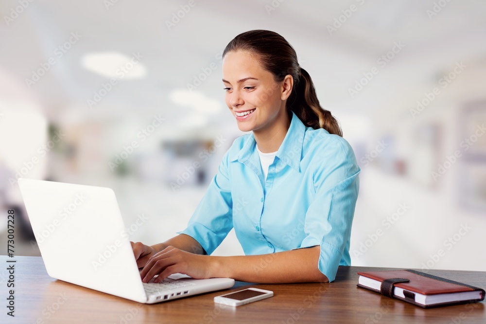 Busy business woman work on laptop in office. Busy business woman work on laptop in office.